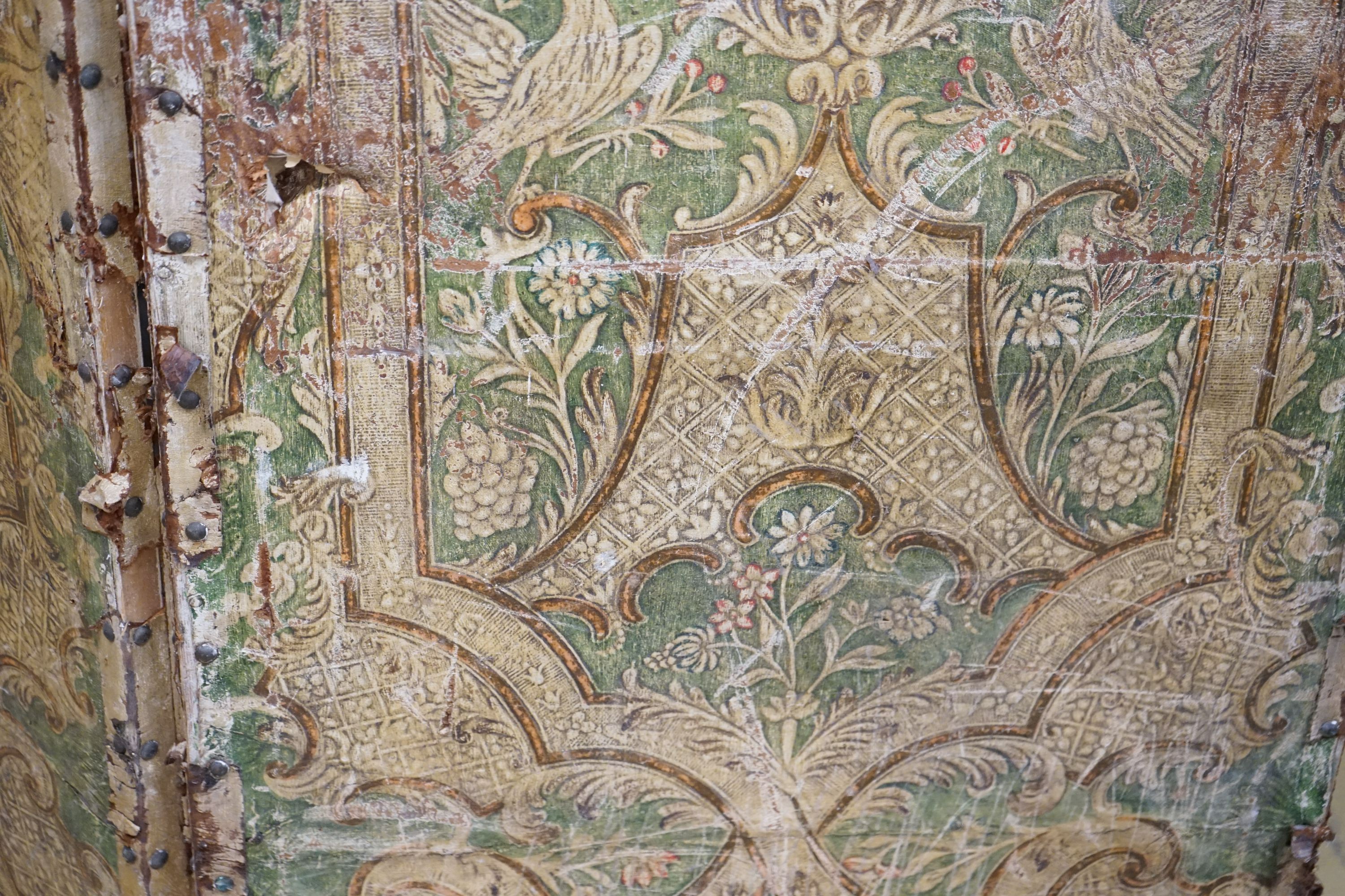 A Spanish painted leather three fold dressing screen, each panel width 60cm, height 237cm